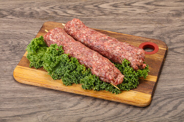 Raw minced beef kebab skewer