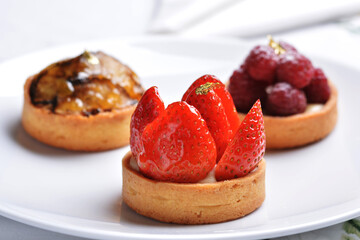 Fruit tarts with gold leaf