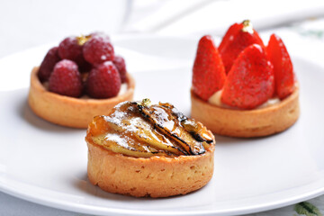 Fruit tarts with gold leaf