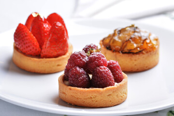 Fruit tarts with gold leaf