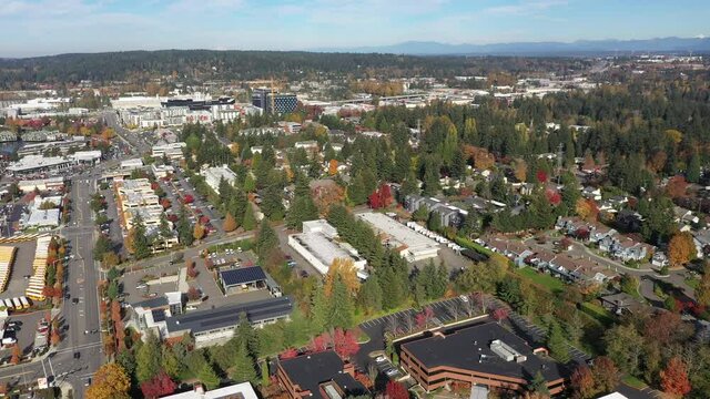 Aerial / drone footage of the new Spring District in Bellevue, Washington downtown with residential and commercial highrise buildings along Interstate highway 405 in King County