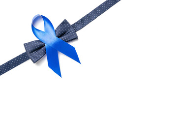 November. Blue ribbon, fashion bowtie isolated on white background. Awareness prostate cancer of...