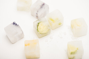 floral, fruit and vegetable refreshing ice cubes on white, stock image
