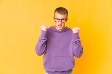 Young caucasian handsome man upset screaming with tense hands.