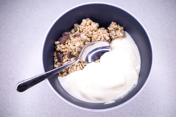 Fototapeta na wymiar A bowl of granola with yogurt