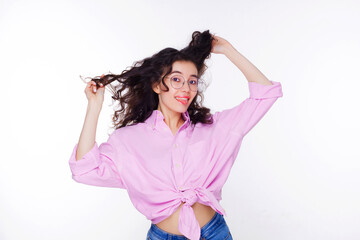 Naklejka premium Image of an excited young Asian woman with her tongue sticking out, standing isolated over white background. Information telling, shopping promotion, announcement, selling support concept