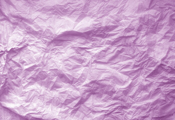 Crumpled violet paper sheet surface.