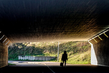 Stockholm, Sweden  A pedestrian in silhouette walks in a tunnel in Danderyd.