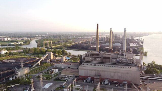 Smokestacks With Blinking Lights At DTE Coal Power Plant In Rouge River, Detroit, Michigan - drone pullback