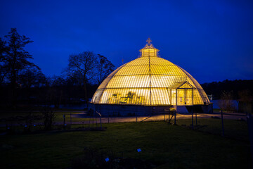 Stockholm, Sweden  The Bergianska Gardens or greeenhouses lit up at night.