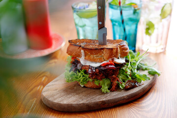 Sandwich with mutton and grilled vegetables.
Appetizing dish. Proposal to serve the dish. Culinary photography.
