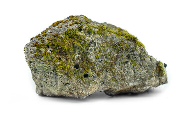 Old stones on a white background overgrown with moss