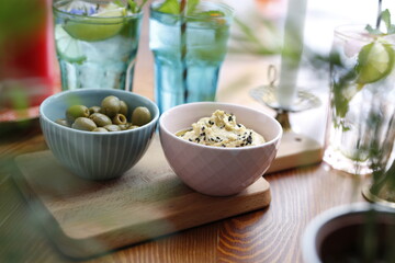 Olives and hummus. Culinary photography. Food styling.