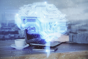 Businessman with computer background with brain theme hologram. Concept of brainstorm. Multi exposure.