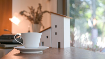 White coffee cup on the counter in a coffee shop.