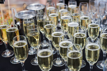 Close up of glasses of champagne on the table with shallow depth of field