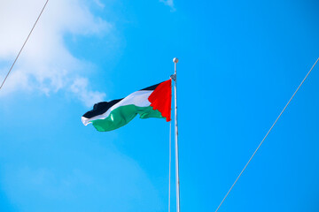 Palestinian flag, blue sky