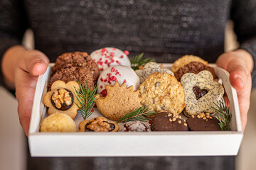 Close up of christmas cakes and cookies with santa hat 