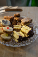 Group of delicious sweet Christmas cookies, white vanilla rolls, gingerbread, linzer and chocolate sweets wiht jam filling