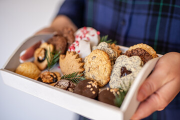 Close up of christmas cakes and cookies with santa hat 