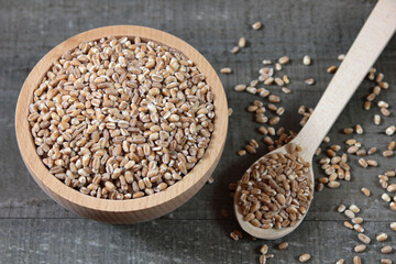Wheat grains in a wooden bowl
