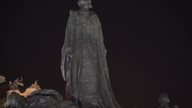 Memorial statue of Jan Hus at night,Old Town Square,Prague,Czechia.