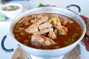 Kaeng Som is a sour and spicy fish curry or soup with vegetables popular in southern Thailand. The curry is characteristic of its sour taste, which comes from tamarind and served in a hot pot.