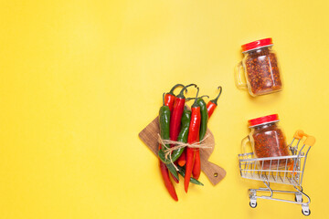 Chili peppers on yellow background, top view. kitchen herbs. day Chile, copyspace