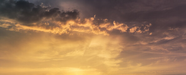 cloudscape with dramatic beautiful stormy clouds at sunset