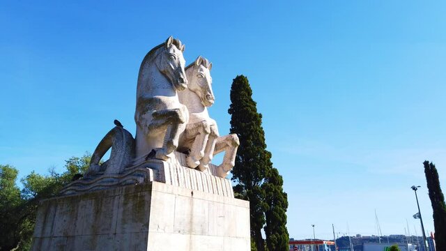 Stone statue with two horses