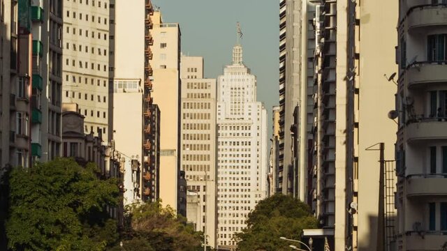 Timelapse of Classic building in S&atilde;o Paulo downtown as the sun goes down and the traffic flows, Brazil.