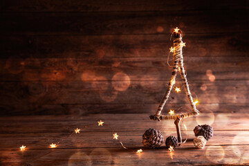 Christmas Tree with fairy lights on rustic wooden background  -  Rustic Xmas Background  -  ...
