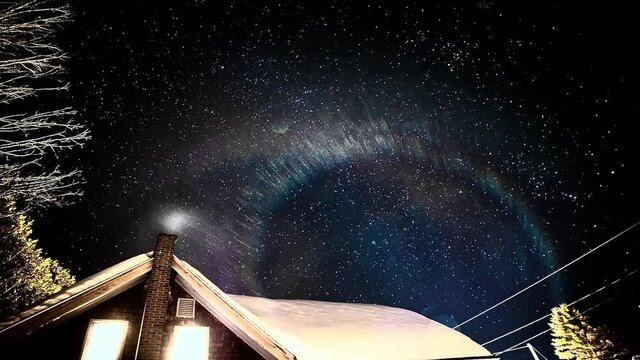 Timelapse of stars snow and smoke at a cabin in central Maine near Sugarloaf Mountain