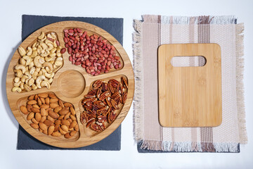 Healthy mix of nuts. Pecans, Cashews, almonds, peanuts, pine nuts, walnuts, hazelnuts. copy space