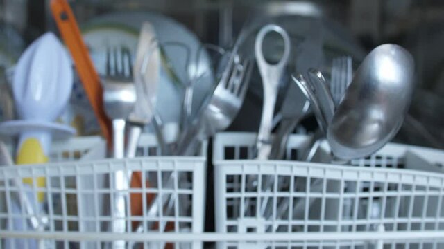 open dishwasher machine, slider shot