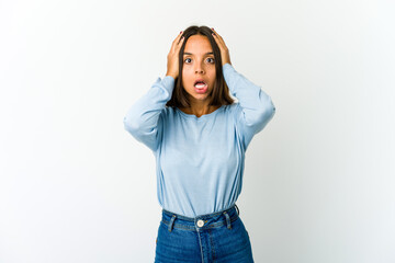 Young mixed race woman screaming, very excited, passionate, satisfied with something.