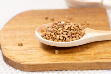 Buckwheat grain dry buckwheat. Close-up of brown buckwheat groats. Healthy food.