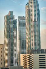 Fototapeta na wymiar View of Makati city during the day. Skyscrapers in clear Sunny weather.