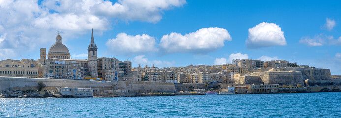 Panorama of Valletta from the seafront showing the dome of the Basilica of Our Lady of Mount Carmel and St Paul's Pro-Cathedral. - 395301970