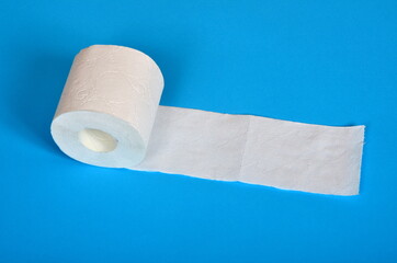 One roll of toilet paper on a blue background