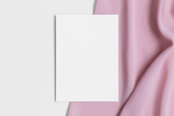 White invitation card mockup with a soft pink textile. 5x7 ratio, similar to A6, A5.