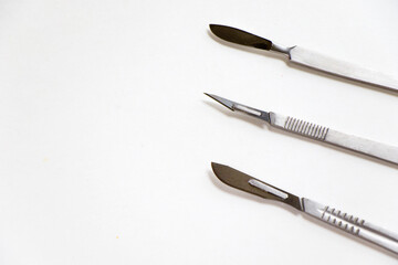 Surgery blade on the sterile table, scalpel close-up, operation equipment