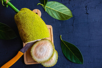 Raw jackfruit sliced ​​on a chopping block