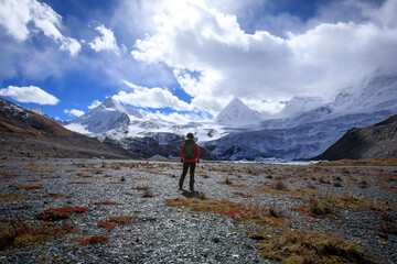 Fototapeta premium Woman hiker hiking in winter mountains