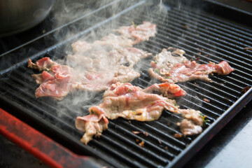 Close up view of chopped meat being grilled on the grilling pan 