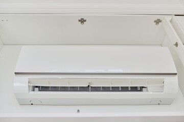 New white air conditioner on the wall in the closet