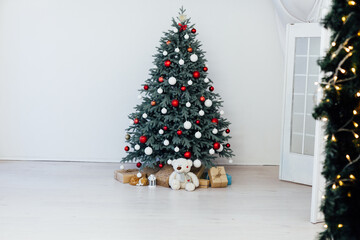 Christmas tree decor with gifts and garlands interior new year