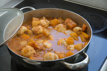 Traditional pumpkin Kubbe soup, a famous middle eastern dumplings soup dish, boiled in a pot
