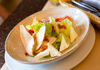 caesar salad with chicken and dehydrated sea buckthorn