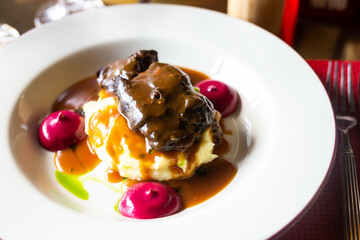 beef cheek with mashed potatoes and currant oil